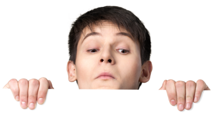 Young man peering over a blank sign