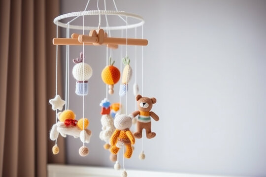 Baby crib mobile, kids handmade toys above the newborn crib. First baby eco-friendly toys made from felt and wood. AI generated image