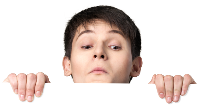 Young man peering over a blank sign