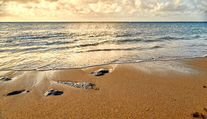 Shore Break Waves on the beach with Volcanic Rock