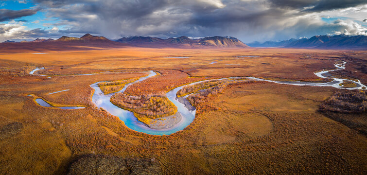 Aerial view in panorama format of tundra in autumn colors in Yukon Territory, Canada