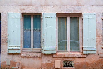 Fototapeta na wymiar Windows with wooden shutters