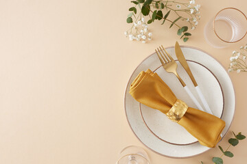 Table decor concept. Top view photo of circle plate cutlery knife fork napkin with ring empty glasses eucalyptus leaves and gypsophila flowers on pastel beige background with empty space