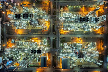 oil refinery and gas petrochemical industry with storage tanks steel pipeline area at twilight.