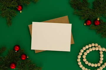 holiday card mockup with pine branches and ornaments