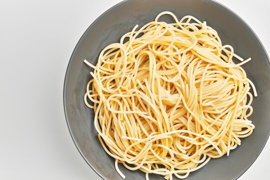  Delicious plate of italian spaghetti pasta over isolated white background