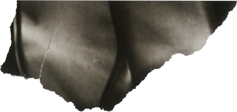 gray textured scrap of magazine paper