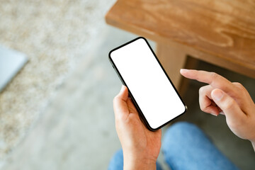 Hand holding empty white screen smart phone on white background.