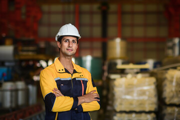 Portrait of handsome and happy brazilian or latin man engineer, technician or worker wearing safety...