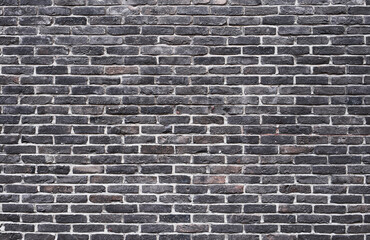 Texture of a black brick wall