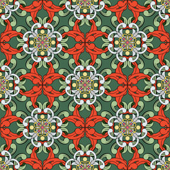 Luxurious damask in red and green shades.