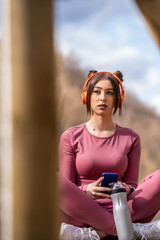 Young Woman Enjoying Wireless Technology in Springtime Photo Shoot.