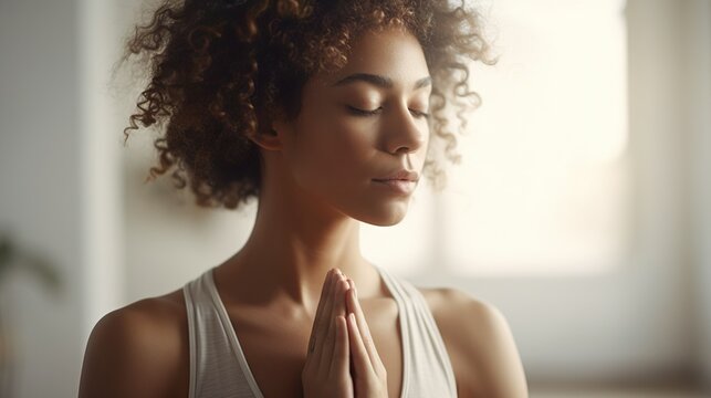 Young black woman practicing yoga in a peaceful space