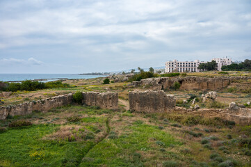 Fototapeta premium Green hills and ruins of the Tombs of the Kings historical site, Paphos, Cyprus