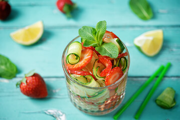 Strawberry lime cucumber mint fresh cocktail in a glass