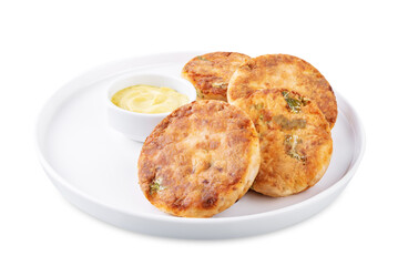 Salmon potato cakes on a white isolated background