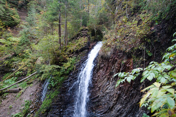 Fototapeta na wymiar Zhenetskyi Huk waterfall in Carpathians, Gorgany mountains, western Ukraine