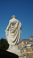 Statue of the Allegory of Spring in backlight, in Piazza del Popolo in Rome