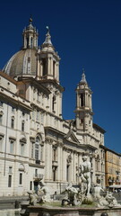 Church of Sant'Agnese in Agone in Piazza Navona with tourists walking around