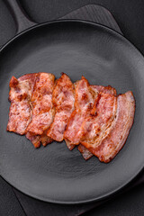 Delicious fresh fried bacon stripes with spices