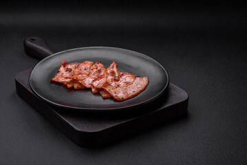 Delicious fresh fried bacon stripes with spices