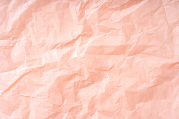 Pink background wrapping paper with crumpled texture. Background for your design.