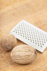 Nutmeg isolated. Whole nut and nutmeg powder isolated on white background.