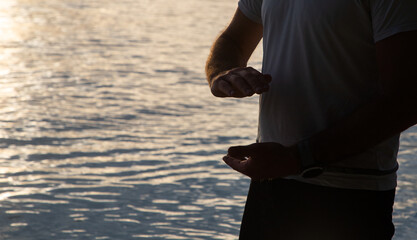 man practicing qigong by the sea