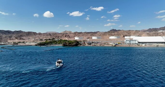 Aerial footage of a boat sailing in the Red Sea in Eilat. Filmed in C4K Apple ProRes 422 HQ