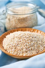 Amaranth seeds and energy bars on wood - Amaranthus