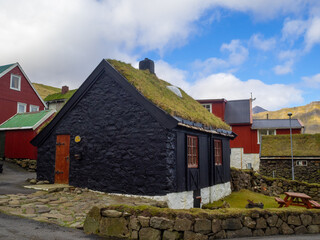 Fototapeta na wymiar Turf roofed black wooden house, Elduvík
