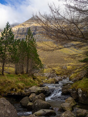 Kunoy park with a cascade brook passing through
