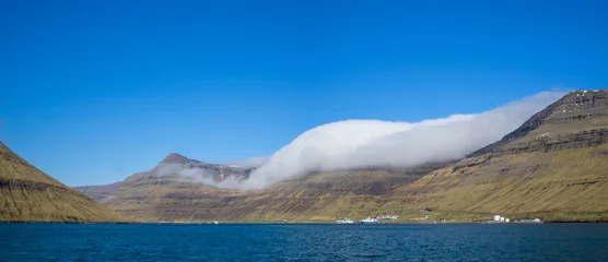 Foto op Canvas A cloud over the Myrkjanoyrarfjall and Snæfelli mountains, by Harraldssund strait, Bordoy © Sérgio Nogueira