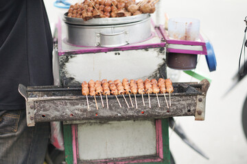 Street food originating from Indonesia is called pentol tofu grilled with spicy sauce. It has a nice and delicious taste