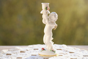 vintage items, white porcelain figurine, candlestick Small cupid of Love with golden wings, angel...