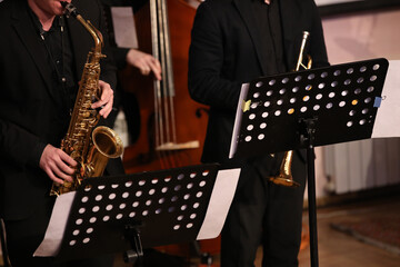 Musician playing the saxophone in a group of jazz players
