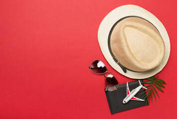 Traveler accessories on color background, top view