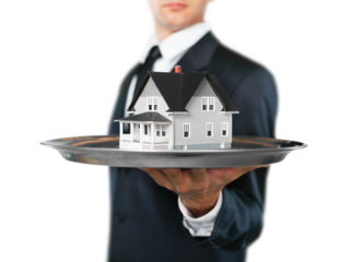 Building, mortgage, real estate and property concept - close up of hand holding house model