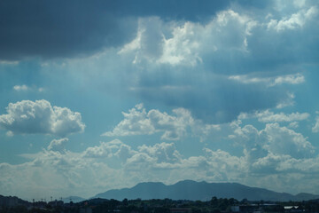 clouds over mountain in sunny day