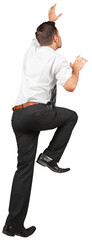 Young Businessman climbing isolated on white background © BillionPhotos.com