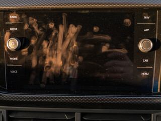 Touch screen system with finger prints smudges. Modern technology. Most used area of display.
