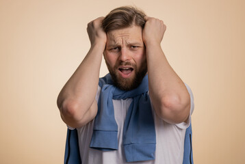 Bearded caucasian man feeling hopelessness loneliness, nervous breakdown, loses becoming surprised...
