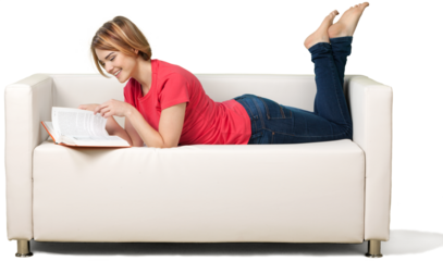 Girl laying on sofa and holding book isolated on white