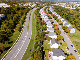 Aerial view of a cluster of houses in a small town in the state of Virginia USA shot by a drone