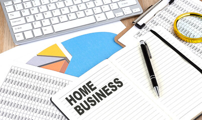 HOME BUSINESS text on a paper on chart background