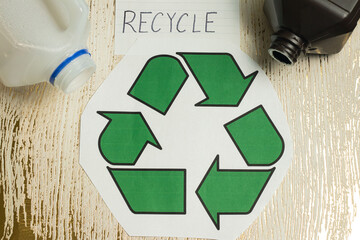 Overhead Angle of a Recycling Symbol on a Wooden Background