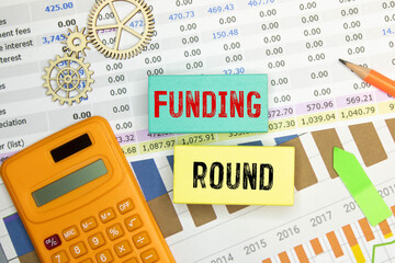 Wooden blocks with words 'Funding round'. Business concept.