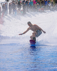 People are enjoying Pond skim at the end of ski season