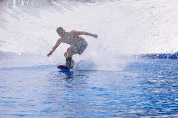Fototapeta premium People are enjoying Pond skim at the end of ski season