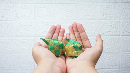 Ketupat (rice dumpling) on white wall. Ketupat is most popular food on Aidilfitri festival